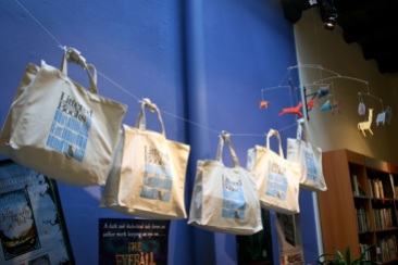 Tote bags lining the wall at Littered with Books, on Duxton Hill in Singapore. (September 11 2011)